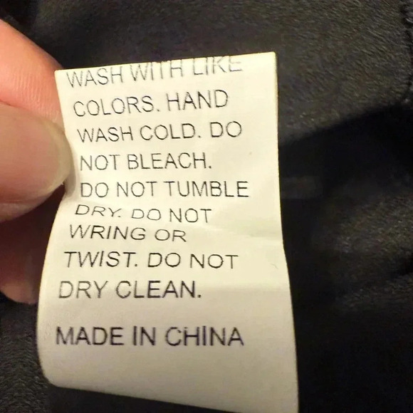 Emery Rose black long sleeve top with scalloped hem sleeves are an open weave - Picture 8 of 8